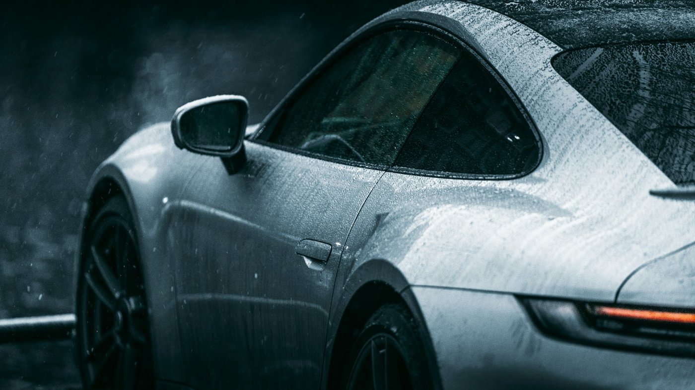 A striking black and white close-up of a vintage classic car